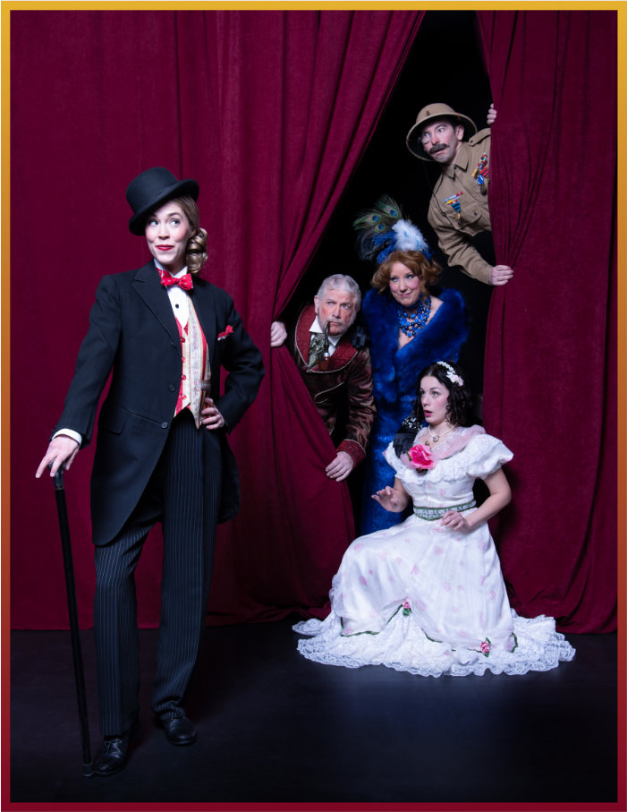 A tuxedoed actress with top hat and cane is viewed from behind a maroon theatre curtain by four other elegantly costumed actors