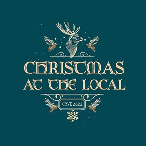 Looking like the sign outside a pub, the title CHRISTMAS AT THE LOCAL is centered against a deep blue background with sprigs of holly, a graphic of a deer with horns, and Est. 2022 above a snowflake.