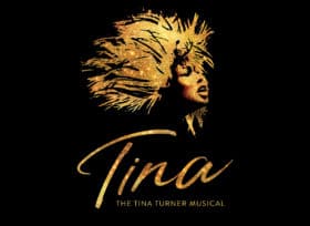 Against a black background is a profile of a woman's open-mouthed face with wild hair all in gold above a scripted ?Tina."
