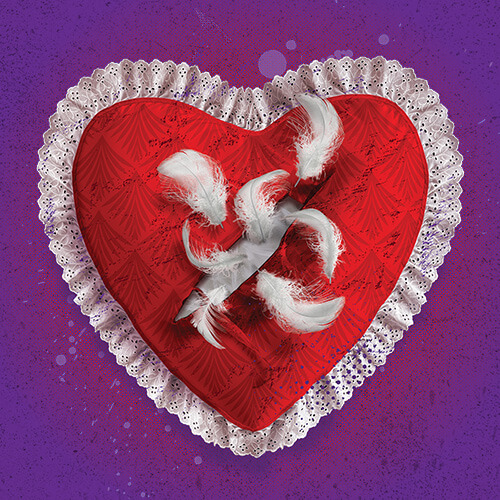 against a purple background a red heart with a white lace trim and white feathers